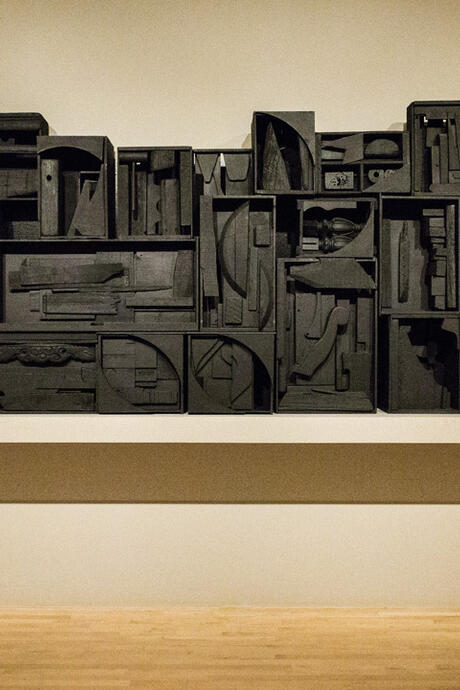 Assemblage of wooden refuse painted in black.